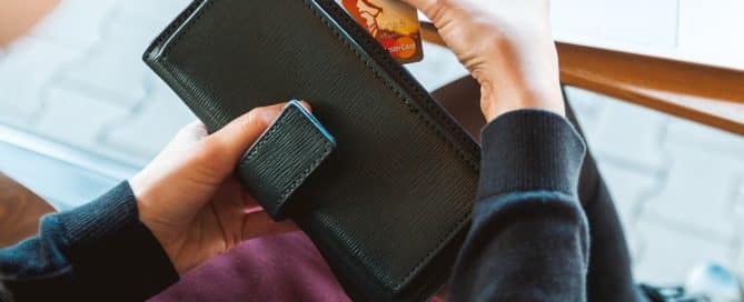 Person pulling card out of wallet